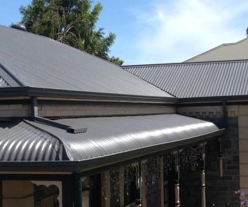 The Benefits of a Reflective Coat of Paint on a Metal Roof for Energy Savings