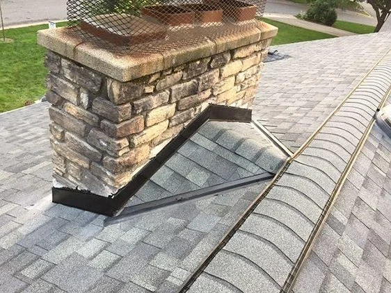 Why You Need a Roofing Cricket Behind a Large Chimney to Prevent Damage