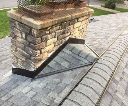 Why You Need a Roofing Cricket Behind a Large Chimney to Prevent Damage