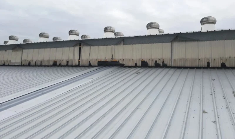 The Impact of Industrial Pollution on the Degradation of Roofing Materials