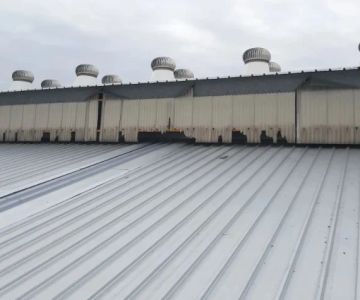 The Impact of Industrial Pollution on the Degradation of Roofing Materials