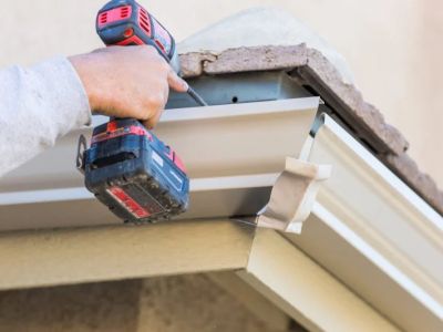 Roof Replacement Cost with Gutters and Downspouts: Complete Guide