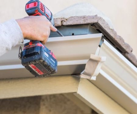 Roof Replacement Cost with Gutters and Downspouts: Complete Guide