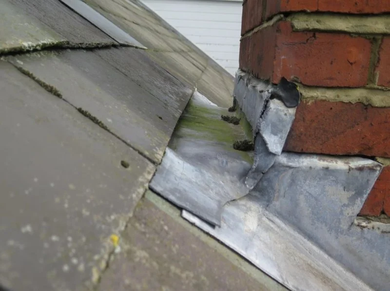Roof Leak Around Chimney: Causes and Repair Solutions | Pro Found Roofing