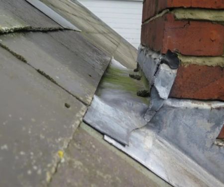 Roof Leak Around Chimney: Causes and Repair Solutions | Pro Found Roofing